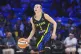 Dallas Wings guard Paige Bueckers (5) dribbles during the first half of a WNBA basketball game against the Los Angeles Sparks in Arlington, Texas, August 15, 2025