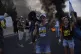 Demonstrators block a road during a protest demanding the immediate release of hostages held by Hamas and calling for the Israeli government to reverse its decision to take over Gaza City and other areas in the Gaza Strip, near Jerusalem, Israel, Aug. 17