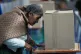 A voter marks her ballot during presidential and legislative elections in La Paz, Bolivia, August 17, 2025