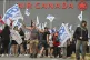 People protest outside Air Canada headquarters in Montreal, August 17, 2025, after the federal government is intervened in the labour dispute between the airline and the union, ordering binding arbitration and operations to resume