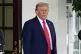 President Donald Trump stands before greeting Ukraine's President Volodymyr Zelenskyy as he arrives at the White House, August 18, 2025, in Washington