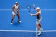 Jack Draper, right, of United States, plays a shot as partner Jessica Pegula, of United States, covers during their mixed doubles match at the U.S. Open tennis championships, Tuesday, Aug. 19, 2025, in New York