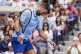 Novak Djokovic, of Serbia, reacts during a mixed doubles match at the U.S. Open tennis championships, Tuesday, Aug. 19, 2025, in New York