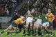 South Africa's Eben Etzebeth, centre, hangs onto the ball as he is supported by teammates during a rugby championship test match between South Africa and Australia, at Cape Town stadium in Cape Town, South Africa, Saturday, Aug. 23, 2025