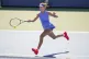 Katie Boulter, of Great Britain, returns a shot to Marta Kostyuk, of Ukraine, during the first round of the US Open tennis championships, August 26, 2025, in New York