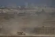 An Israeli tank moves along the Israeli-Gaza border as seen from southern Israel, August 28, 2025