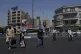 People cross a street in downtown Tehran, Iran, August 28, 2025