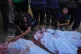 Young Palestinian Tariq Nasser, 12, right, mourns over the body of his brother Ayman Nasser, who was killed in an Israeli military strike, during his funeral outside Shifa Hospital in Gaza City