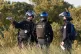 French authorities seen on a beach in Gravelines, France, as they prepare to fire tear gas at a group of people thought to be migrants, June 17, 2025
