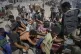 Palestinians are carried after being wounded while trying to reach trucks carrying humanitarian aid en route to Gaza City, in the outskirts of Beit Lahiya, northern Gaza Strip, August 1, 2025