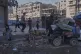 Displaced Palestinians fleeing northern Gaza Strip move with their belongings on a street in Gaza City, August 28, 2025