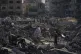 People inspect the damage at the Sheikh Radwan al-Taba UNRWA clinic following an Israeli army bombardment in Gaza City, August 6, 2025