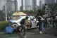 Students attack a police car during a protest following the death of a delivery rider who was run over by a police armored vehicle in a rally against lawmakers' privilege, in Jakarta, Indonesia, August 29, 2025
