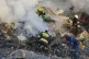 Firefighters work at the site of a burning building after a Russian attack in Kyiv, Ukraine, August 28, 2025