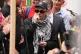 Kneecap's Liam Og O hAnnaidh, speaks to supporters as he leaves Westminster Magistrates' Court, London, where he was charged with a terrorism offence, August 20, 2025