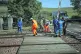Emergency personnel at Carmont crossing, where they are removing wooden supports, so that emergency vehicles can access the train line from the road, south of the scene in Stonehaven, Aberdeenshire