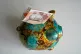 A �10 note issued by the Bank of England featuring a portrait of King Charles III in a piggy bank. Picture date: Tuesday August 20, 2024