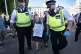 A supporter of Palestine Action is detained by police after taking part in a mass action in Parliament Square, Westminster, central London, organised by Defend Our Juries, August 9, 2025