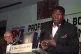 British Heavyweight boxer Frank Bruno speaking at the first ever Annual Dinner of the Professional Boxers Association in London, watched by commentator Harry Carptenter, June 22, 1994