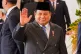 Indonesian President Prabowo Subianto waves to journalists at Merdeka Palace in Jakarta, Indonesia, July 29, 2025