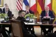 Ukraine's President Volodymyr Zelenskyy speaks as British Prime Minister Keir Starmer, seated from background left, France's President Emmanuel Macron and President Donald Trump listen during a meeting in the East Room of the White House, August 18, 2025