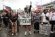 MAJOR PROTESTS: (left) Young people call out endemic corruption as massive protests and rioting