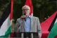 Jeremy Corbyn speaks in front of Palestine flags
