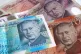 A view of £5, £10, £20 and £50 bank notes