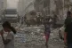 A Palestinian girl walks past a heavily damaged building in the Rimal neighborhood, in Gaza City, Sunday, Aug. 31, 2025, a day after it was hit by an Israeli military strike that killed several people