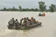 Indian army soldiers travel in boats through floodwaters to rescue the stranded people following heavy rains in Kapurthala district of northern state of Punjab, India, September 2, 2025