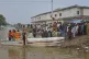 Villagers get off from a boat after being evacuated by rescue workers from a flooded area following raising water level in rivers, in Jalalpur Pirwala, in Multan district, Pakistan, September 8, 2025
