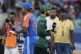 Pakistan's captain Salman Agha, right, walks past India's captain Suryakumar Yadav after the coin toss ahead of the Asia Cup cricket match between India and Pakistan at Dubai International Cricket Stadium in Dubai, United Arab Emirates, Sunday, Sept. 14, 2025