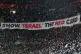 Celtic fans lift a protest banner about Israel during the Champions League playoff first leg soccer match between Glasgow Celtic and Bayern Munich at the Celtic Park Stadium in Glasgow, Scotland, February 12, 2025