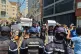 Demonstrators hold up placards reading 