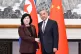 Chinese Foreign Minister Wang Yi (right) shakes hands with visiting North Korean counterpart Choe Son Hui prior to a meeting, in Beijing, September 28, 2025