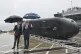 Australian Minister for Defence Industry Pat Conroy and Defense Minister Richard Marles (left) are pictured with an autonomous undersea vehicle known as the Ghost Shark at HMAS Kuttabul naval base, September 10, 2025. Photo: Mick Tsikas/AAP Image via AP