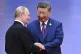 Russian President Vladimir Putin (left) and Chinese President Xi Jinping greet each other at a ceremony to welcome Heads of States of the Shanghai Cooperation Organization (SCO) summit in Tianjin, China, August 31, 2025