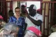 Guinea's interim President, Gen. Mamadi Doumbouya, departs with his wife after casting his vote in the constitutional referendum in Conakry, Guinea, September 21, 2025