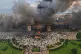 Protesters celebrate at the Singha Durbar, the seat of Nepal's government's various ministries and offices after it was set on fire during a protest against social media ban and corruption in Kathmandu, Nepal, September 9, 2025