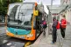 Passengers queue to board a bus in Cardiff