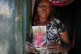 Rose Wanyua Wanjiku, elder sister to Agnes Wanjiru, 20, holds a photograph of Agnes, at Rose's house in the Majengo informal settlement in Nanyuki, Kenya, November 4, 2021
