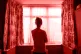 A woman looking out of a window
