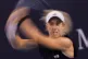 Sonay Kartal, of Britain plays a backhand return to Mirra Andreeva during the women's singles match of the China Open tennis tournament, at the National Tennis Center, in Beijing, Wednesday, Oct. 1, 2025