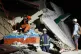 Rescuers check for survivors in the ruins of a collapsed building, October 1, 2025 after a strong earthquake struck Bogo city, Cebu Province, Central Philippines