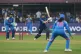 England's Heather Knight, center, plays a shot during the ICC Women's Cricket World Cup match between India and England in Indore, India, Sunday, Oct. 19, 2025