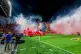 Smoke from flares thrown by fans fills the field before the soccer derby between Maccabi Tel Aviv and Hapoel Tel Aviv was called off Sunday after pregame disturbances led police to deem it unsafe to proceed at Bloomfield Stadium in Tel Aviv, Israel, Sunday, Oct. 19, 2025