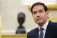 Secretary of State Marco Rubio listens as President Donald Trump meets with NATO Secretary General Mark Rutte in the Oval Office of the White House, October 22, 2025, in Washington