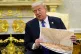President Donald Trump holds an artist rendering of interior of the new White House ballroom as meets with NATO Secretary General Mark Rutte in the Oval Office of the White House, Wednesday, Oct. 22, 2025, in Washington
