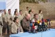 Kurdistan Workers' Party (PKK) fighters, who reportedly withdrew from Turkey with their weapons, stand to attention during a ceremony in the Qandil area of northern, Iraq, Oct 26, 2025