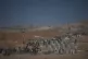 Palestinians inspect the remains of a site that housed a distribution center operated by the U.S.-backed Gaza Humanitarian Foundation (GHF) in Netzarim, central Gaza Strip, October 10, 2025
